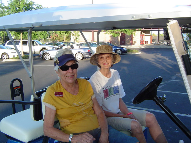 walkers in golf cart